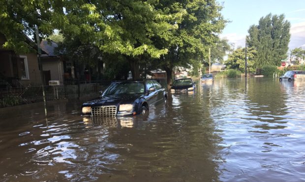 Cars sit in bumper-deep water near Smiths Ballpark in Salt Lake City. Photo credit: Shara Park, KSL...
