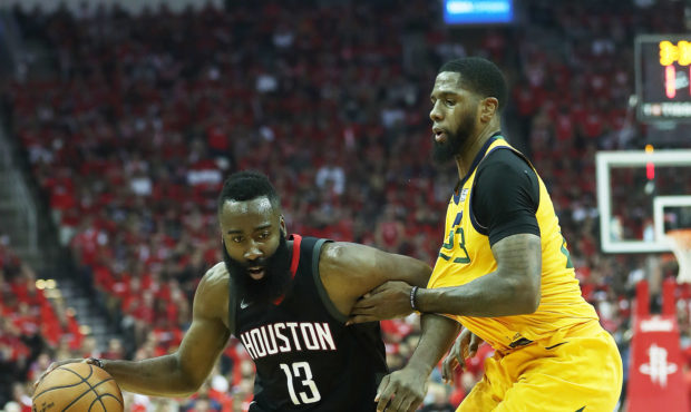 Houston Rockets guard James Harden (13) drives around Utah Jazz forward Royce O'Neale (23) as the U...