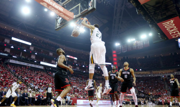 Utah Jazz center Rudy Gobert (27) puts down a dunk as the Utah Jazz and the Houston Rockets play ga...