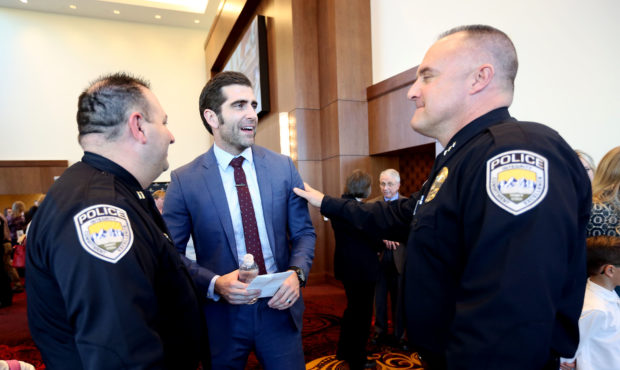Sandy City Police Capt. Jeff Duval, left, and Deputy Chief Bill O'Neal, right, talk with Sandy City...