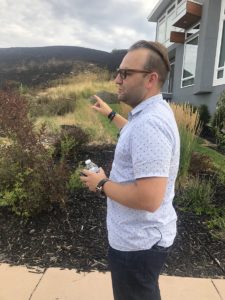 Dustin Holt helped save his own home with a garden hose