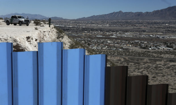 FILE - In this Jan. 25, 2017, file photo, an agent from the border patrol, observes near the Mexico...