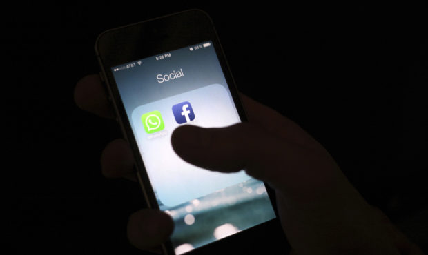 FILE - This Feb. 19, 2014, file photo shows the Facebook app icon on an iPhone in New York. Apple s...