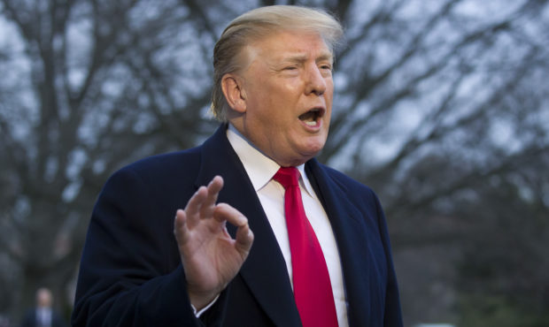 FILE - President Donald Trump speaks with the media after stepping off Marine One on the South Lawn...
