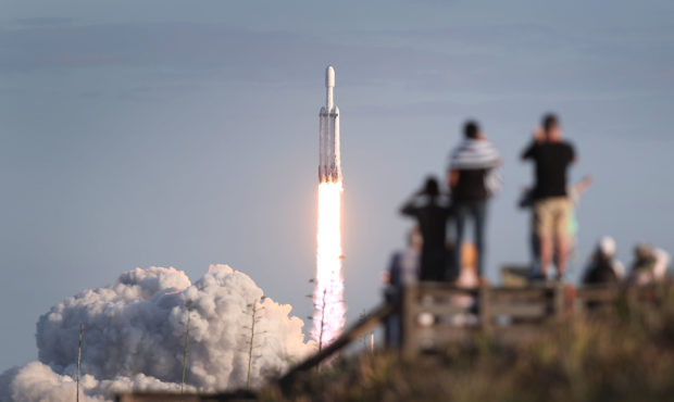 TITUSVILLE, FLORIDA - APRIL 11: People watch as the SpaceX Falcon Heavy rocket lifts off from launc...