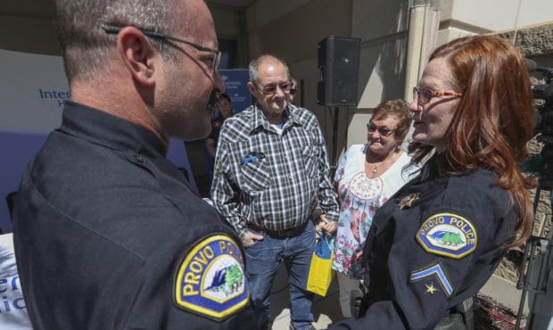 (Photo Credit: Steve Griffin, Deseret News.  Center: John Lindsey speaks with Ken and Robyn Newell ...