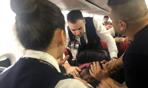 The scene as Associated Press photographer Hussein Malla observes as passengers and crew aboard a T...