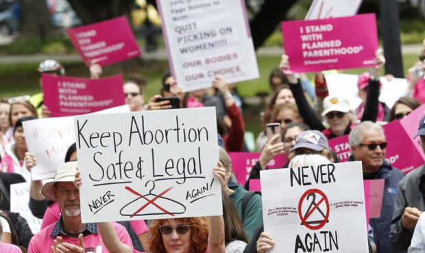 FILE - In this May 21, 2019, file photo, People gather at the state Capitol to rally in support of ...