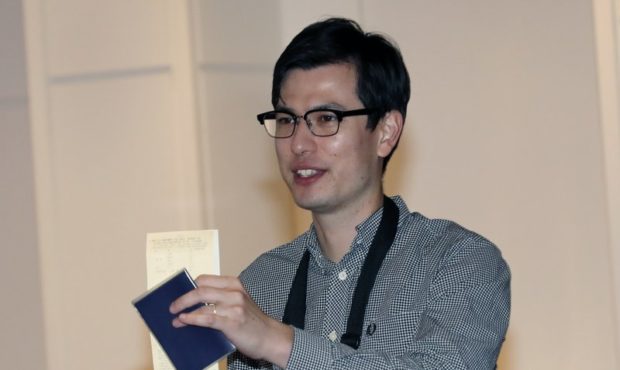 Australian student Alek Sigley gestures as he arrives at the airport in Tokyo on Thursday, July 4, ...