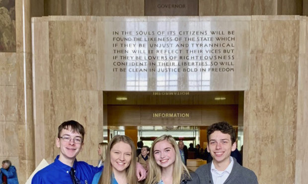In this Feb. 6, 2019 photo provided by Providence Health & Services, from left, Sam Adamson, Lo...