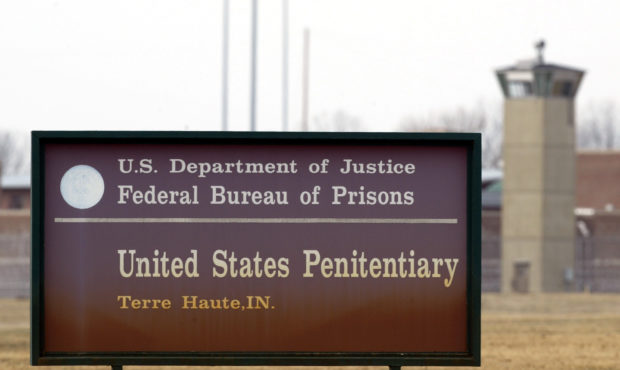 FILE - In this March 17, 2003 file photo, the guard tower flanks the sign at the entrance to the U....