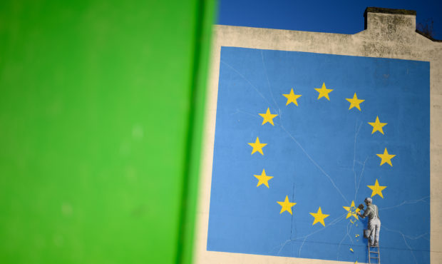 DOVER, ENGLAND - JANUARY 03: A painting depicting a workman chipping away at a star on the EU flag ...