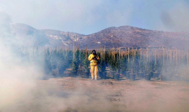 Associated Press photographer Marcio Jose Sanchez covers a wildfire Oct. 30, 2019, in Simi Valley, ...