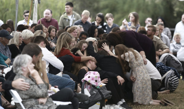People attend the funeral of Dawna Ray Langford, 43, and her sons Trevor, 11, and Rogan, 2, who wer...