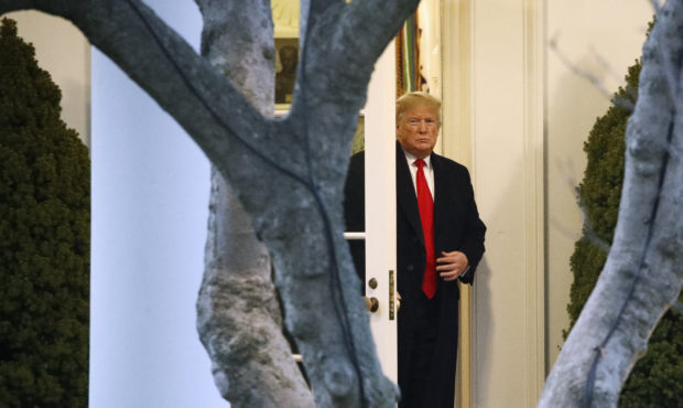 President Donald Trump leaves the Oval Office as he walks to Marine One on the South Lawn of the Wh...