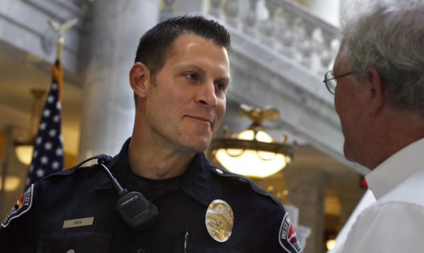 West Valley police officer Kevin Peck is congratulated after receiving the Law Enforcement Humanita...