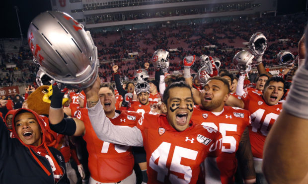 FILE PHOTO: Utah wide receiver Samson Nacua (45) celebrates with his teammates after their victory ...
