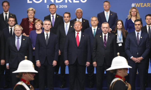 From front row left, British Prime Minister Boris Johnson, NATO Secretary General Jens Stoltenberg,...