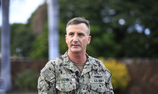U.S. Navy Rear Adm. Robb Chadwick speaks to the media at the main gate at Joint Base Pearl Harbor-H...