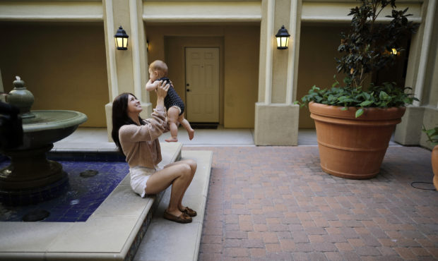 FILE - In this Aug. 24, 2018 file photo Keira Sumimoto plays with her daughter, in Irvine, Calif. S...