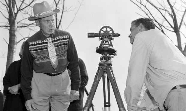 FILE - In this April 18, 1958 file photo, Philip N. Brooks, right, a New York State surveyor, takes...