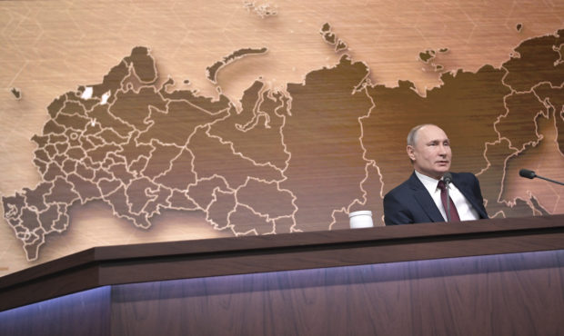 Russian President Vladimir Putin speaks during his annual news conference in Moscow, Russia, Thursd...