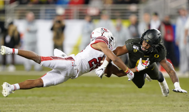 SANTA CLARA, CALIFORNIA - DECEMBER 06: Safety Jevon Holland #8 of the Oregon Ducks breaks up this p...