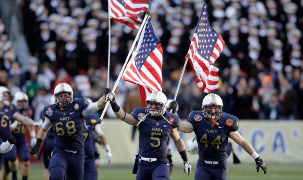 LANDOVER, MD - DECEMBER 10:  John Dowd #68, Brian Blick #5, and Max Blue #44 of the Navy Midshipmen...