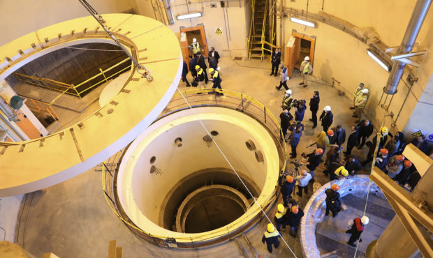 In this photo released by the Atomic Energy Organization of Iran, technicians work at the Arak heav...