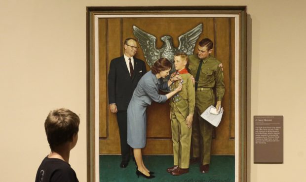 FILE - In this July 22, 2013, file photo, a youth looks over the Norman Rockwell exhibition in Salt...