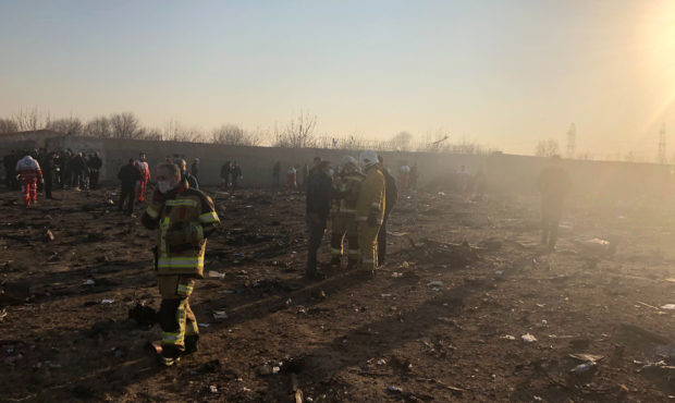 CORRECTS YEAR - Debris is seen from a plane crash on the outskirts of Tehran, Iran, Wednesday, Jan....