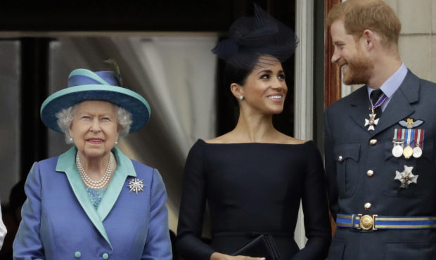 FILE - In this Tuesday, July 10, 2018 file photo Britain's Queen Elizabeth II, and Meghan the Duche...