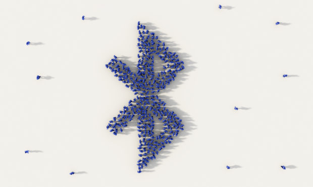 Large group of people forming bluetooth symbol in social media and community concept on white backg...