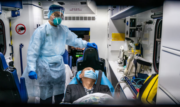 HONG KONG, CHINA - JANUARY 22: A patient is transferred by an ambulance to the Infectious Disease C...