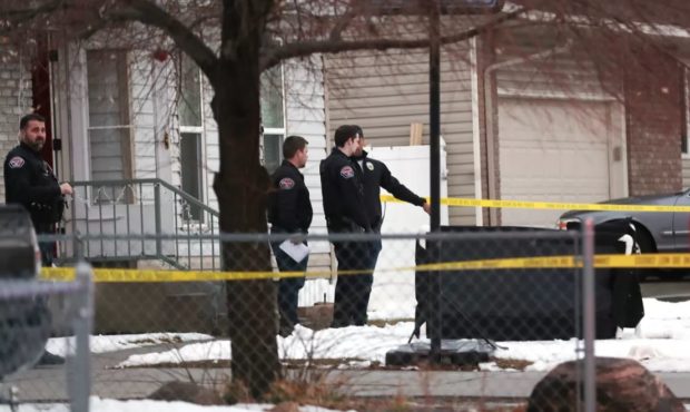 (Police investigating the scene of a shooting on Deann Drive.  Credit: Scott G. Winterton, Deseret ...