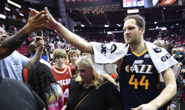Utah Jazz forward Bojan Bogdanovic (44) high-fives a fan after shooting the game-winning three poin...