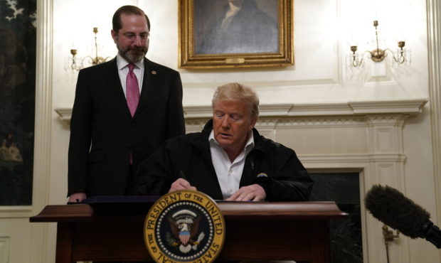 President Donald Trump signs an $8.3 billion bill to fight the coronavirus outbreak in the U.S., Fr...