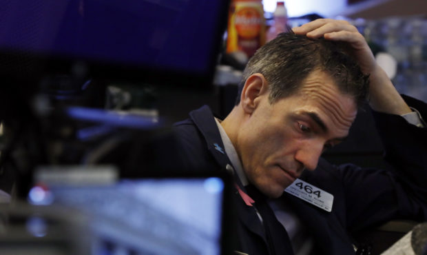 Trader Gregory Rowe prepares for the day's activity on the floor of the New York Stock Exchange, Mo...