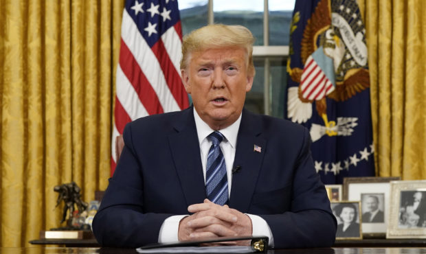 President Donald Trump speaks in an address to the nation from the Oval Office at the White House a...