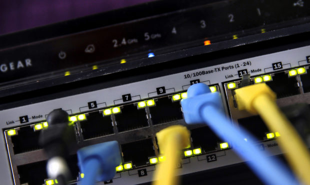FILE - In this June 19, 2018, file photo, a router and internet switch are displayed in East Derry,...