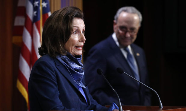 House Speaker Nancy Pelosi of Calif., speaks with reporters alongside Senate Minority Leader Sen. C...