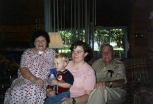 Four generations in one picture: grandfather, daughter, grand-daughter, great-grandson