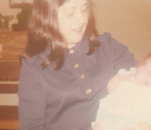 mother holding baby