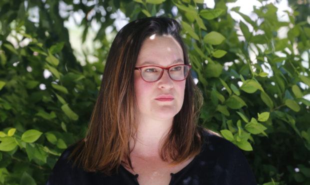 In this Wednesday, June 24, 2020, photo, Marina Gomberg stands in her back yard, in Salt Lake City....