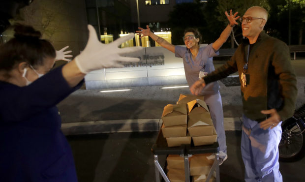 Nightbird Restaurant chef and owner Kim Alter, left, mimics giving a hug to nurse practitioner Sydn...