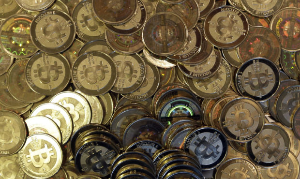 FILE - This April 3, 2013, file photo shows bitcoin tokens in Sandy, Utah. Unidentified hackers bro...