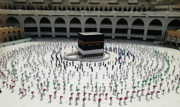 Hundreds of Muslim pilgrims circle the Kaaba, the cubic building at the Grand Mosque, as they keep ...