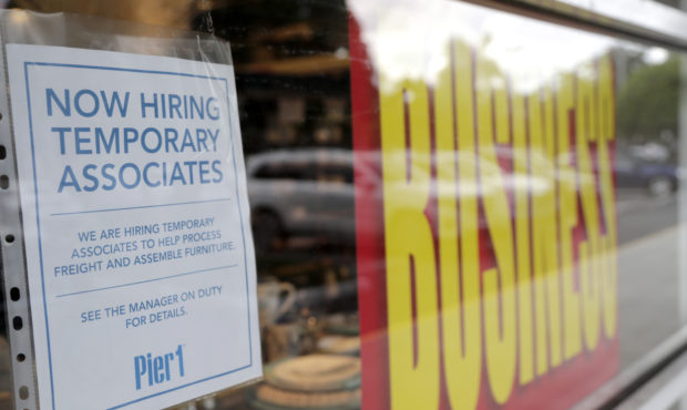 A sign advertises hiring of temporary associates at a Pier 1 retail store, which is going out of bu...