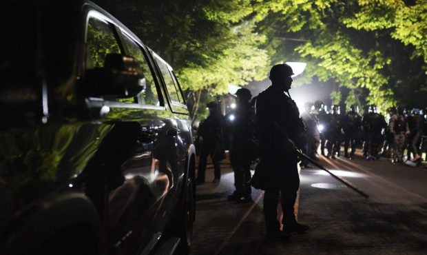 Riot declared as fire burns in Portland police union offices...