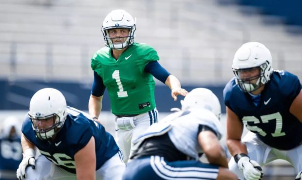 (BYU QB Zach Wilson taking snaps during fall camp in Provo.  Photo Credit, Jaren Wilkey, BYU)...